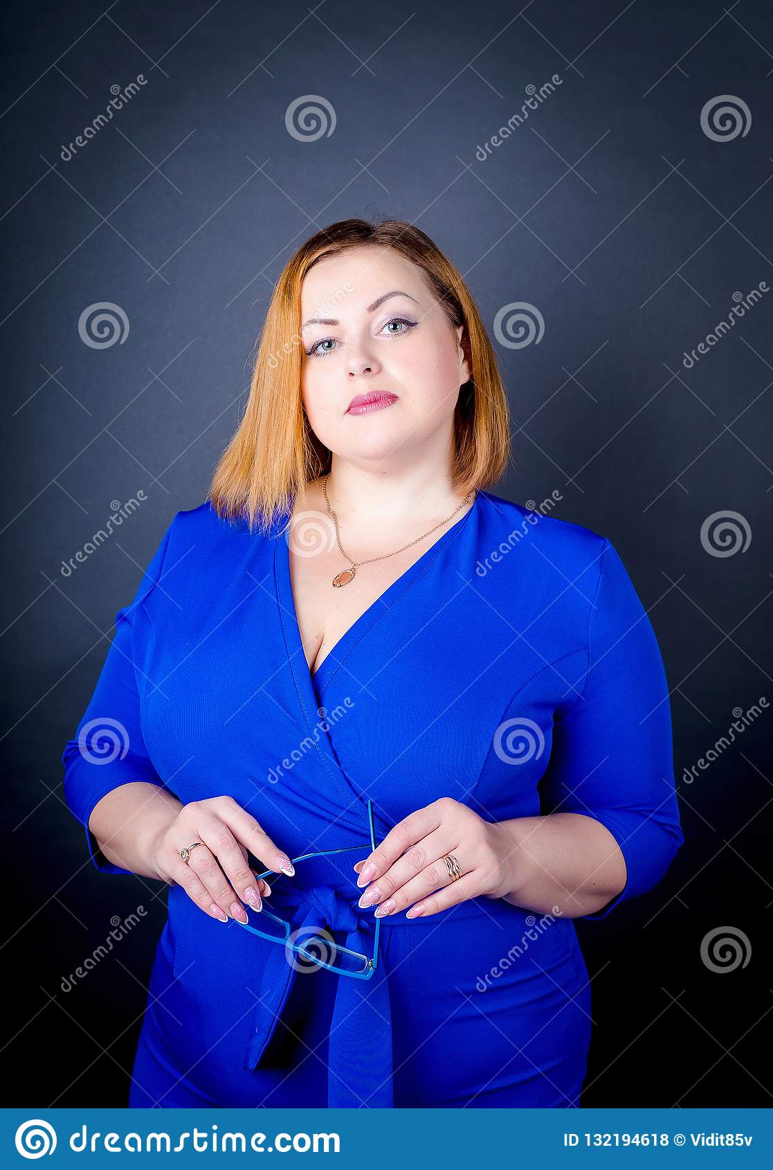 Beautiful Chubby Girl In Blue Elegant Dress On A Black Background ...