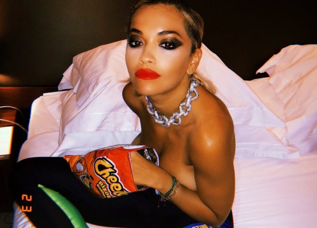 Rita Ora topless as she enjoys after-party with a bag of ...
