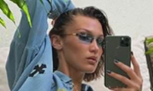 Bella Hadid leaves little to the imagination as she snaps a ...