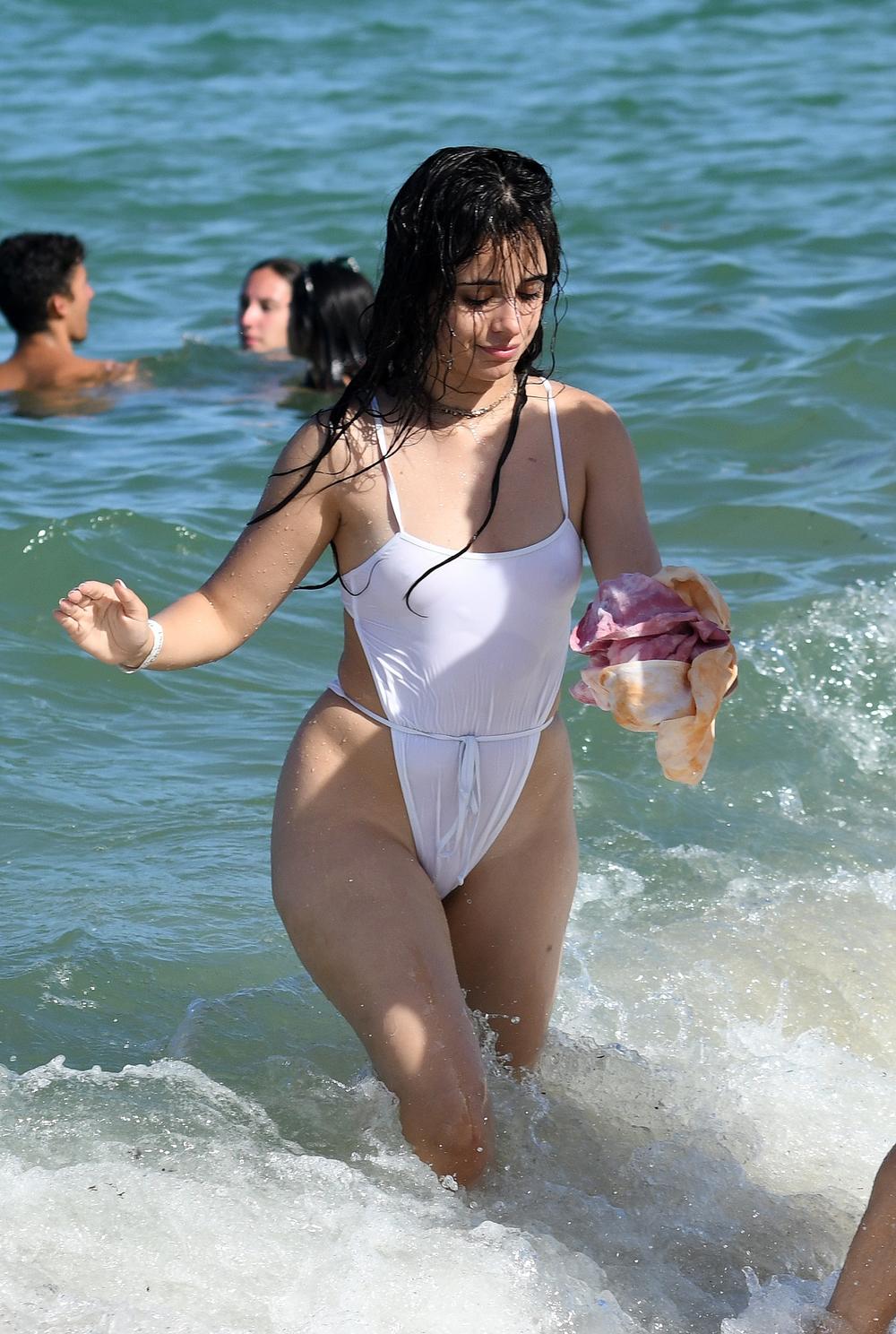 Camila Cabello Gets Wet in a See-Through White Bathing Suit