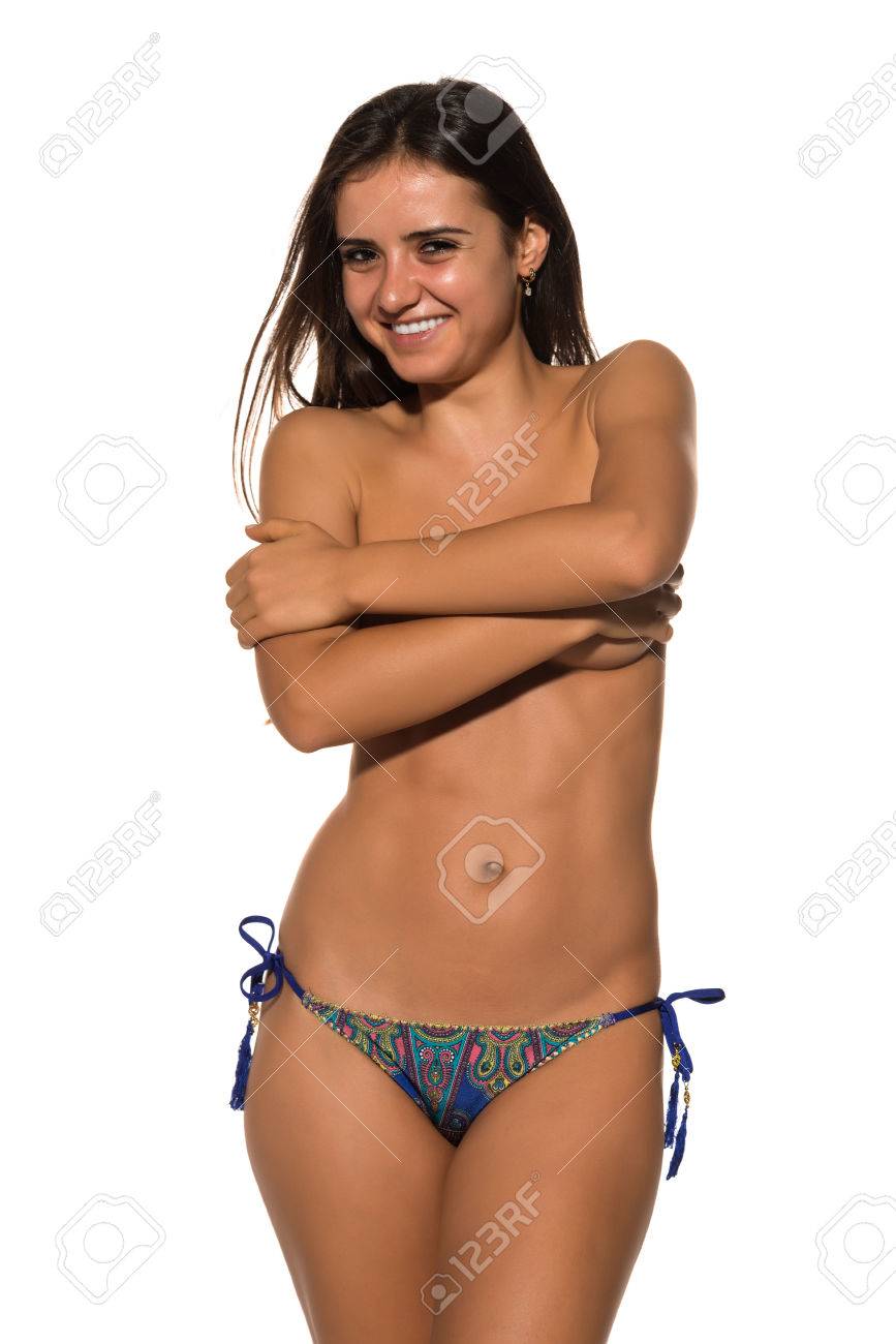 Pretty Romanian brunette topless in blue bikini bottoms