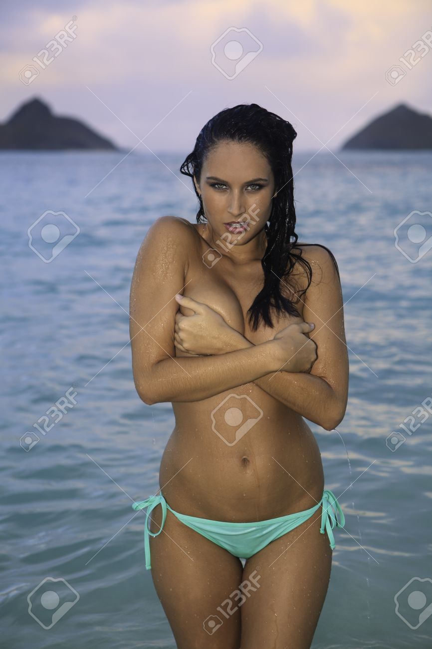 beautiful topless girl in bikini on the beach