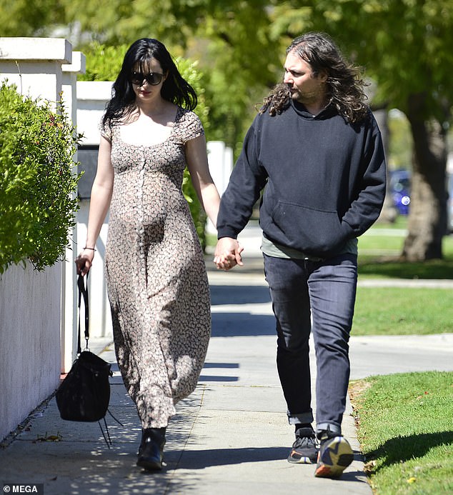 Pregnant Krysten Ritter showcases bump in floral frock with ...