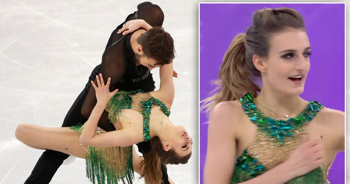 Figure skater flashes nipple after suffering wardrobe ...