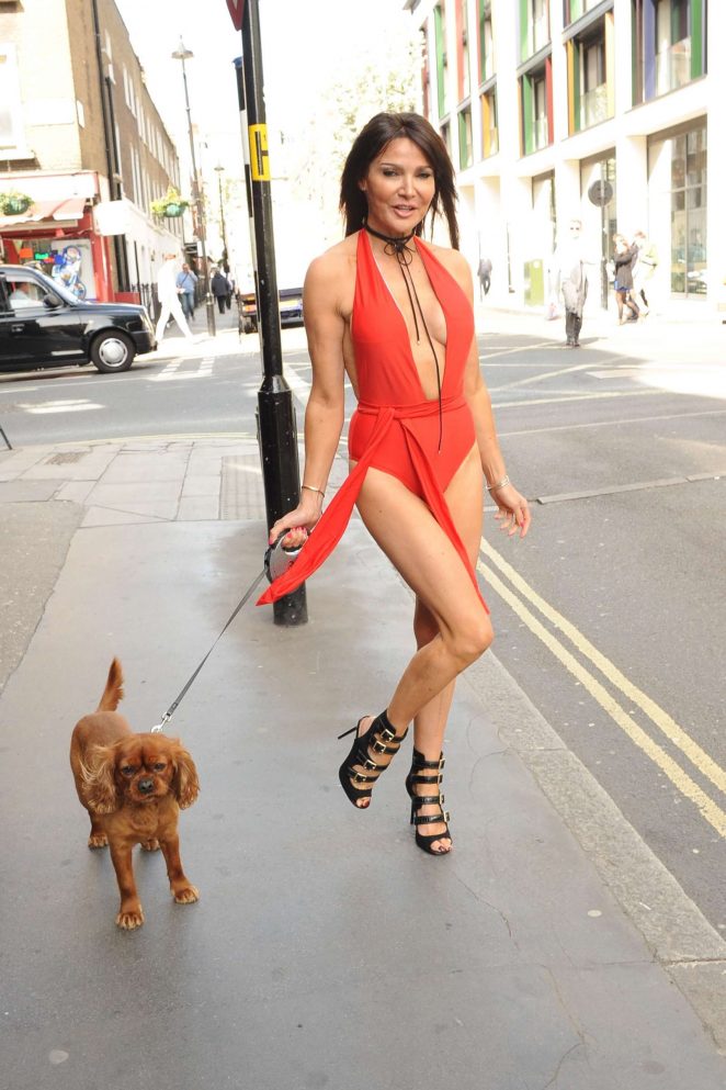 Lizzie Cundy in Red with her dog out in London | GotCeleb