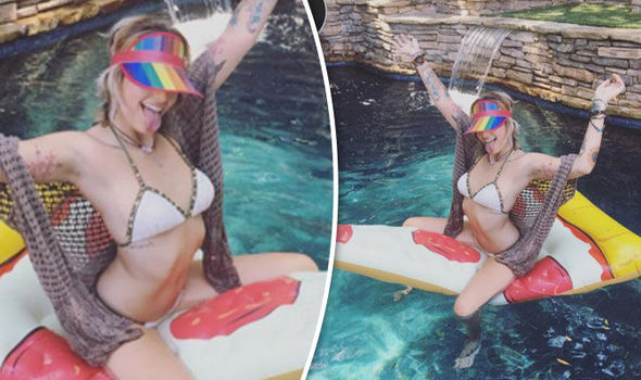 Paris Jackson STRIPS OFF and straddles pool float in racy ...
