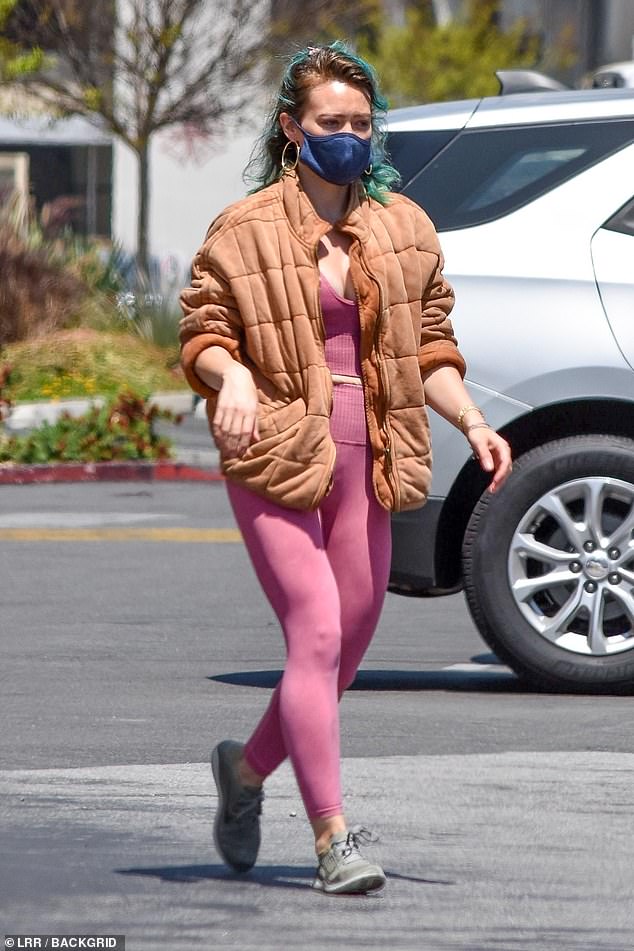 Hilary Duff rocks skin-tight pink outfit and mask during grocery ...