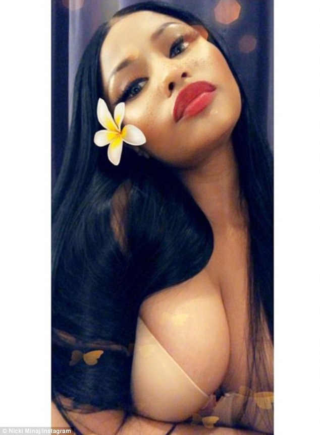 Nicki Minaj shows off ample cleavage in nude bra after insisting ...